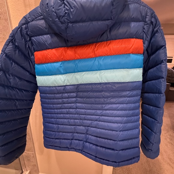Cotopaxi Woman’s Puffer Jacket in Blue with Orange and Light Blue Accents - Picture 4 of 5